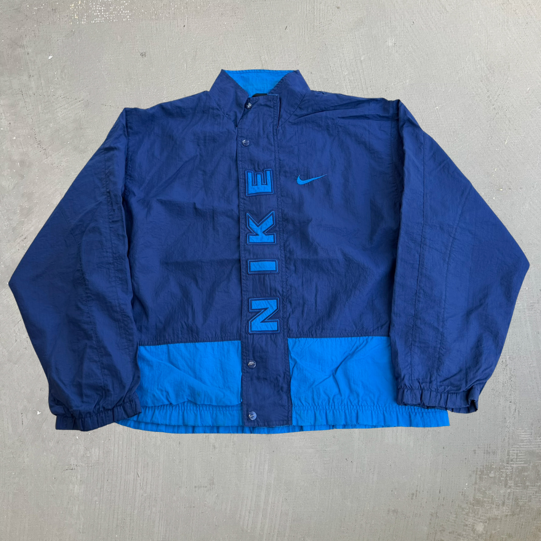 J- Vintage 90s Nike Embroidered Text & Swoosh Lightweight Zip Up Navy/Blue Jacket - M