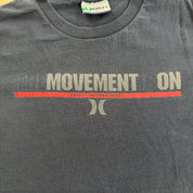 J- Vintage Hurley International The Movement Is On Graphic Text Made In USA Tee - XL