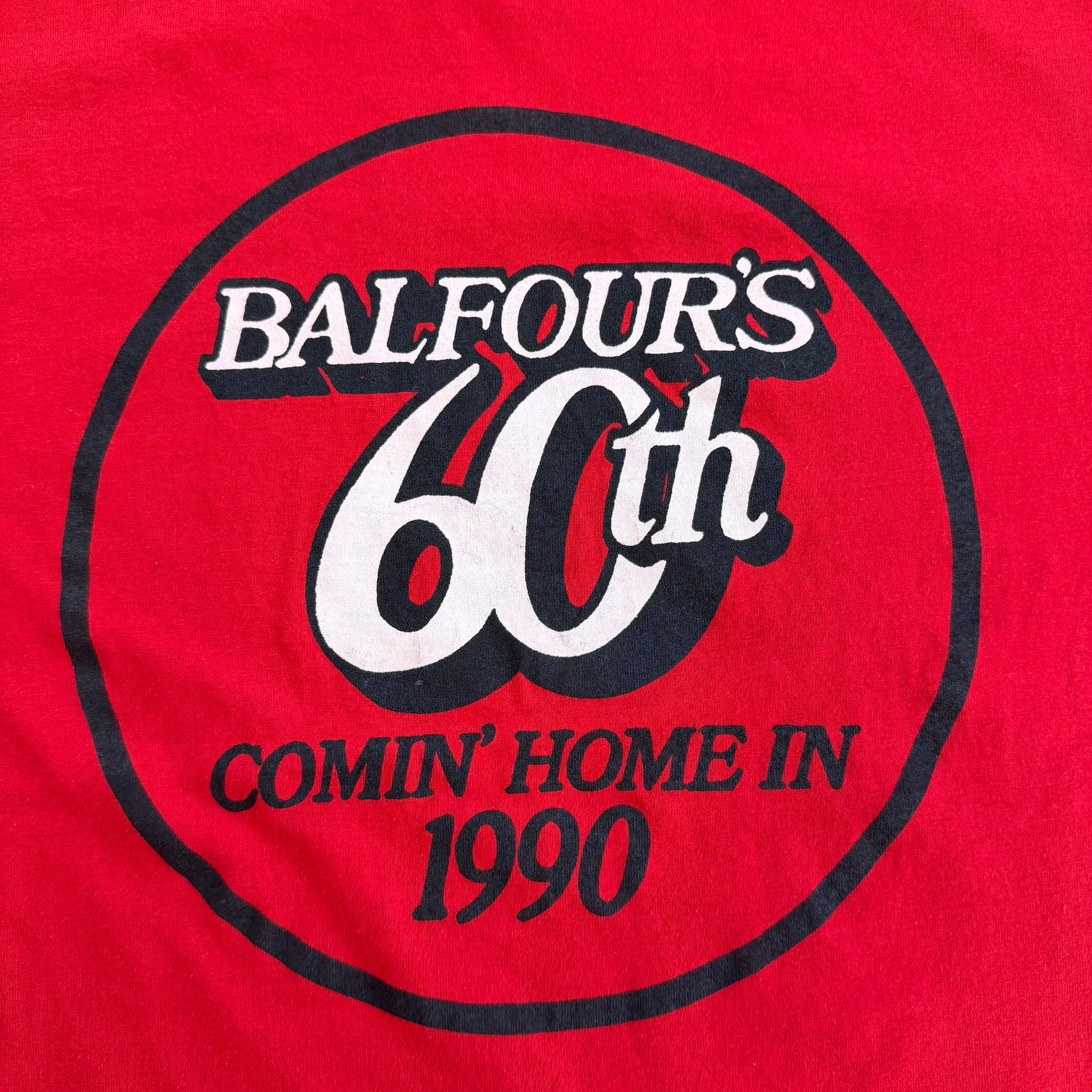 J- Vintage '90 Balfour's 60th Comin' Home In Text Graphic Single Stitch Tee - L