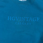 J- Vintage HG Vintage Calgary Embroidered Text Teal Russell Made In USA Crewneck - L